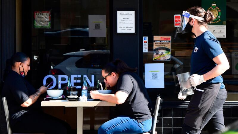 People dine outdoors in Pasadena, California. AFP