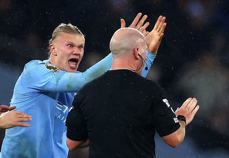 Manchester City's Erling Haaland remonstrates with Simon Hooper after the referee's controversial late call against Tottenham Hotspur. Reuters