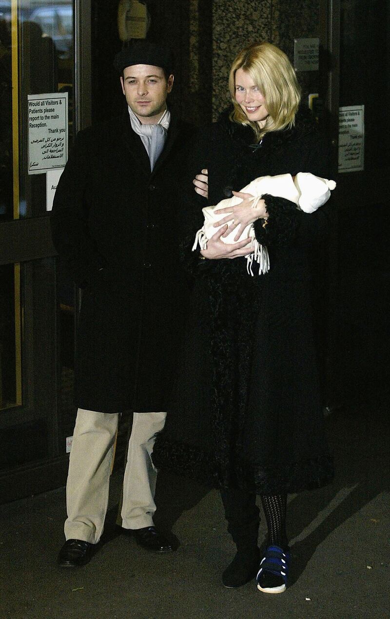 LONDON - FEBRUARY 6:  Supermodel Claudia Schiffer is pictured with her husband Matthew Vaughn and their baby son Caspar outside the Portland Hospital on February 6, 2003 in London. Caspar was born on January 30, 2003 by caesarean section and weighed seven pounds. (Photo by Warren Little/Getty Images)