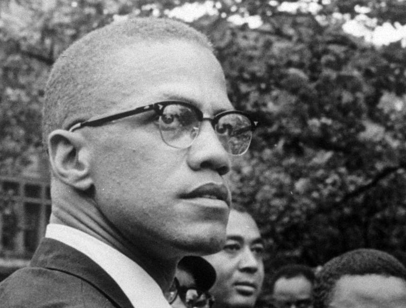 FILE - In this 1963 file photo, Black Nationalist leader Malcolm X attends a rally at Lennox Avenue and 115th Street in the Harlem neighborhood of New York. For decades, a burning question loomed over one of the most important books of the 20th century, â€œThe Autobiography of Malcolm Xâ€: What happened to the reputedly missing chapters that may have contained some of his most explosive thoughts. The answer came on Thursday, July 26, 2018, when an unpublished manuscript of a chapter titled â€œThe Negroâ€ was sold by Guernseyâ€™s auction house in Manhattan, for $7,000. The buyer was The New York Public Libraryâ€™s Schomburg Center for Research in Black Culture. (AP Photo/Robert Haggins, File)