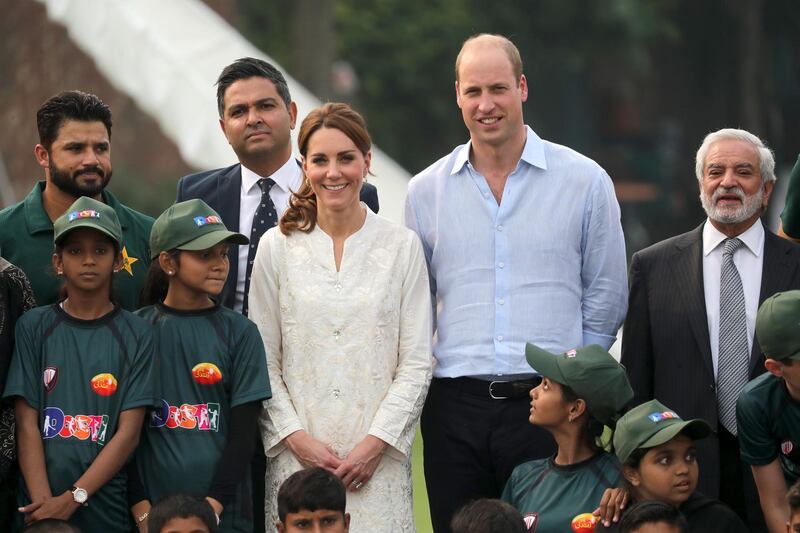 Prince William, Duke of Cambridge and Catherine, Duchess of Cambridge pose with Azhar Ali (far left) and Ehsan Mani, the Pakistan Cricket Board chief (right) during their visit at the National Cricket Academy during day four of their royal tour of Pakistan on Thursday, October 17, 2019 in Lahore, Pakistan. Getty Images