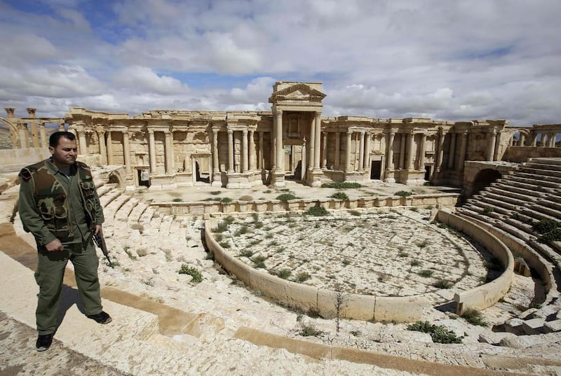 This photo from March 14, 2014 show a Syrian policeman patrolling the ancient city of Palmyra. Joseph Eid/AFP Photo

