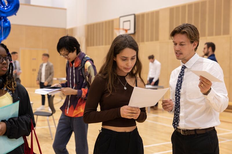 Sarah Vlan de Castro receives her grades at City of London Shoreditch Park school in London. Getty Images