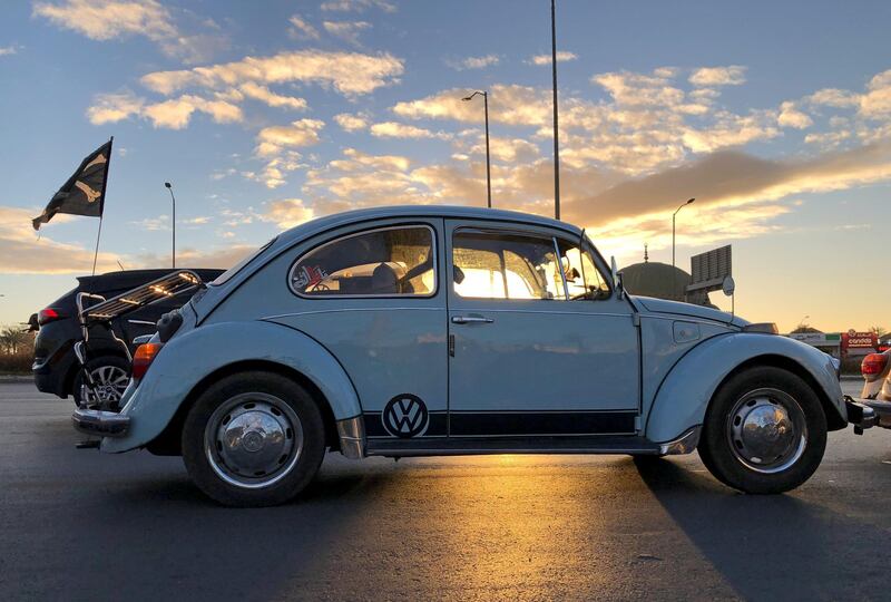 Egyptian enthusiasts of German carmaker Volkswagen's "Beetle" and members of the "Egypt Beetle Club" drive during their tour around Cairo, Egypt January 29, 2021. Picture taken January 29, 2021. REUTERS/Ahmed Fahmy