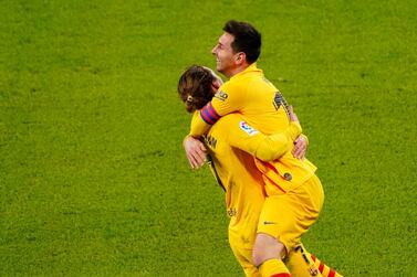 Barcelona's Lionel Messi celebrates scoring their third goal with Antoine Griezmann. Reuters