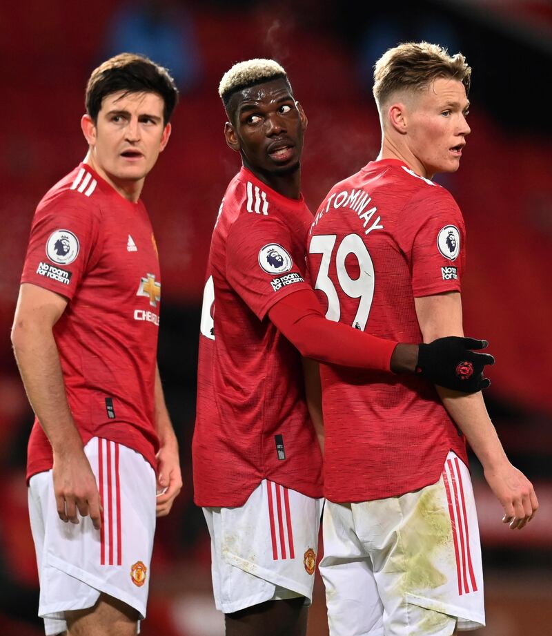 Paul Pogba stands in the wall with teammates Harry Maguire and Scott McTominay. AP