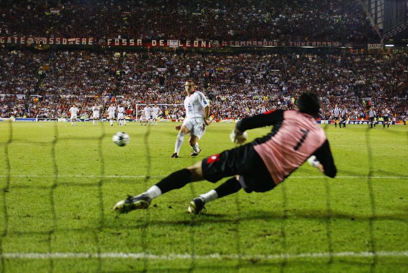 MANCHESTER - MAY 28:  Andrei Shevchenko of AC Milan scores the winning penalty during the UEFA Champions League Final match between Juventus FC and AC Milan on May 28, 2003 at Old Trafford in Manchester, England.  AC Milan won the final 3-2 on penalties. (Photo by Laurence Griffiths/Getty Images)