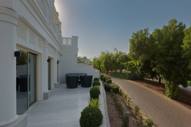 The downstairs terrace backs on to the golf course