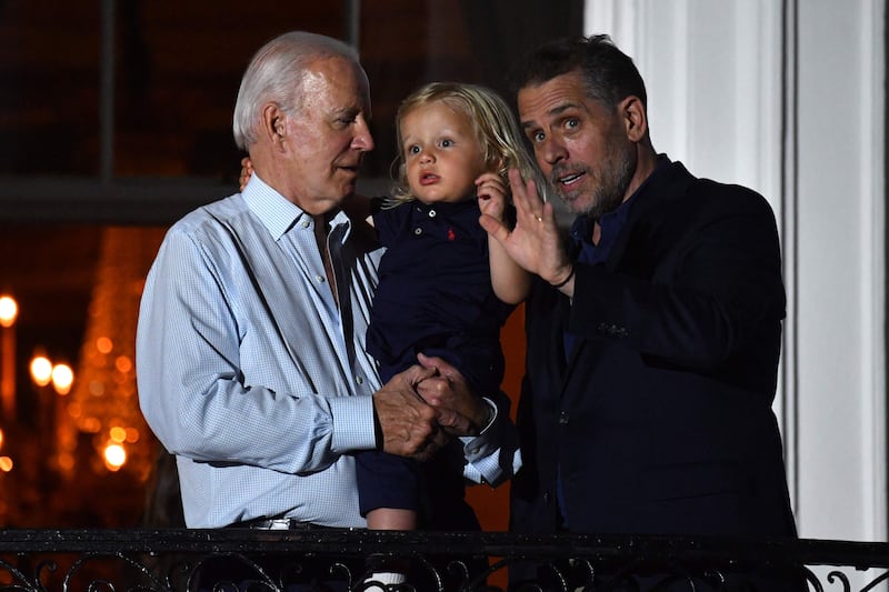 President Joe Biden with his son Hunter and grandson Beau. AFP