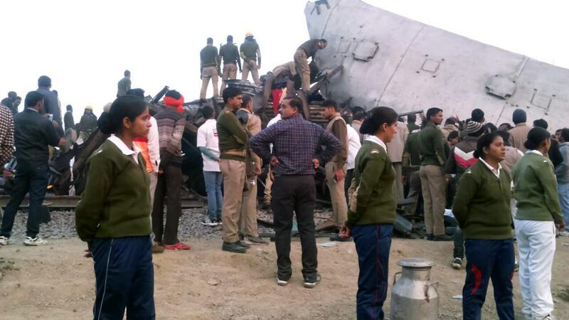 Rescue works continue at the site of an accident where coaches of an Indore-Patna Express train derailed off the tracks in Kanpur, India. Ritesh Shukla / EPA