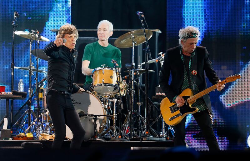 Mick Jagger (left), Charlie Watts (centre) and Keith Richards of The Rolling Stones perform during a concert in Abu Dhabi on February 21, 2014. Reuters