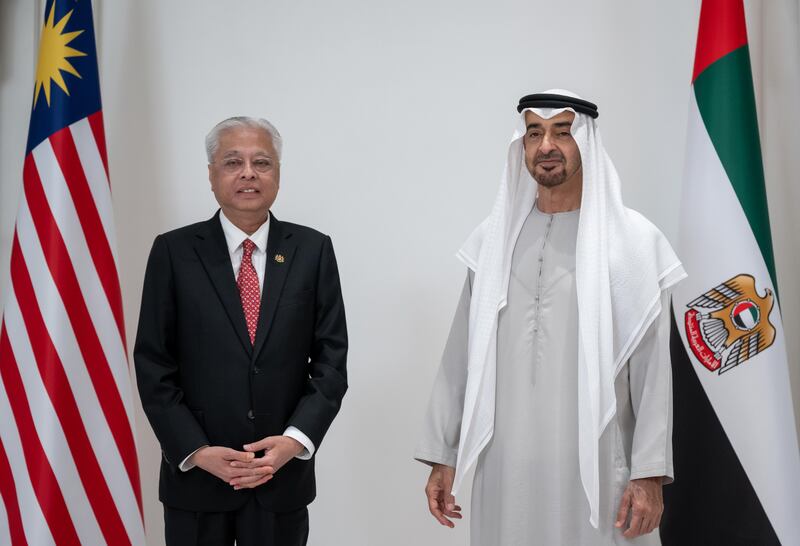 President Sheikh Mohamed and Mr Ismail stand for a photograph.
