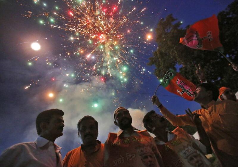 Fireworks explode as supporters of Bharatiya Janata Party (BJP) celebrate, after Narendra Modi was sworn in as India’s prime minister, outside the BJP headquarters in New Delhi. Anindito Mukherjee / Reuters