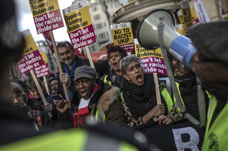 LONDON, ENGLAND - DECEMBER 09: People holding placards opposing Tommy Robinson take part in a separate protest ahead of a UKIP-backed Brexit betrayal rally on December 9, 2018 in London, England. The demonstration takes place three days before parliament is due to make the crucial vote on Theresa May's Brexit deal with the European Union. (Photo by Dan Kitwood/Getty Images)