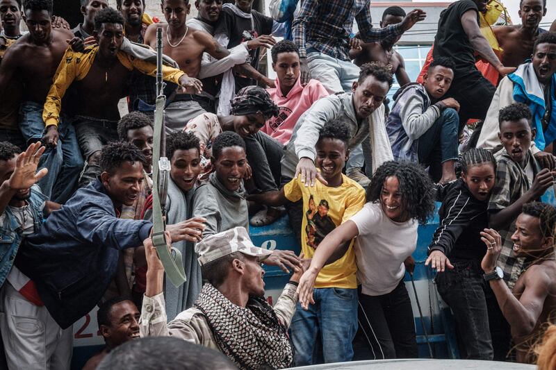 A soldier of Tigray Defence Force (TDF) is welcomed by people upoon his return in Mekelle.