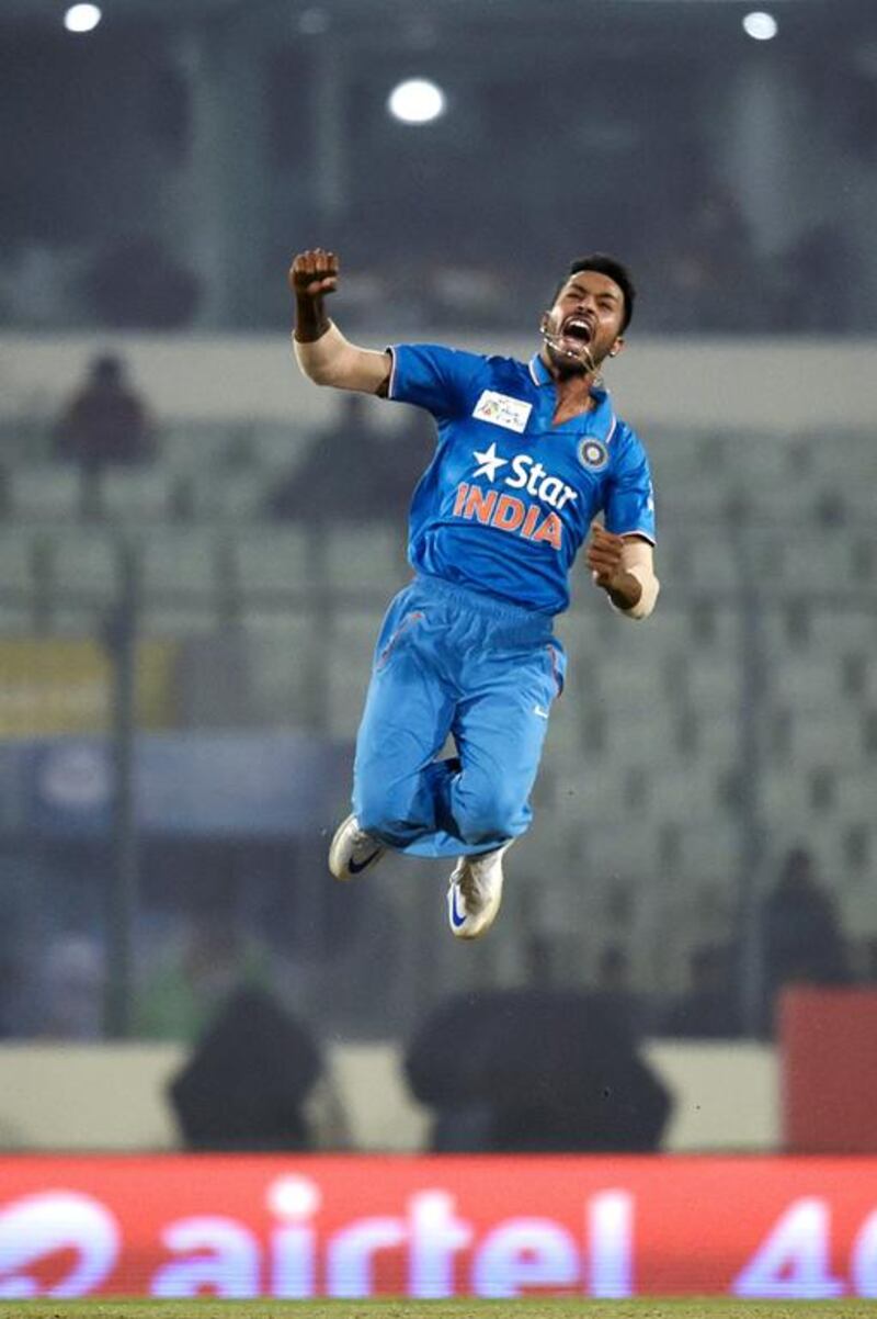 India’s Hardik Pandya celebrates after the dismissal of Sri Lanka’s Angelo Mathews during the Asia Cup T20 cricket tournament match between India and Sri Lanka at the Sher-e-Bangla National Cricket Stadium in Dhaka on March 1, 2016. / AFP / MUNIR UZ ZAMAN