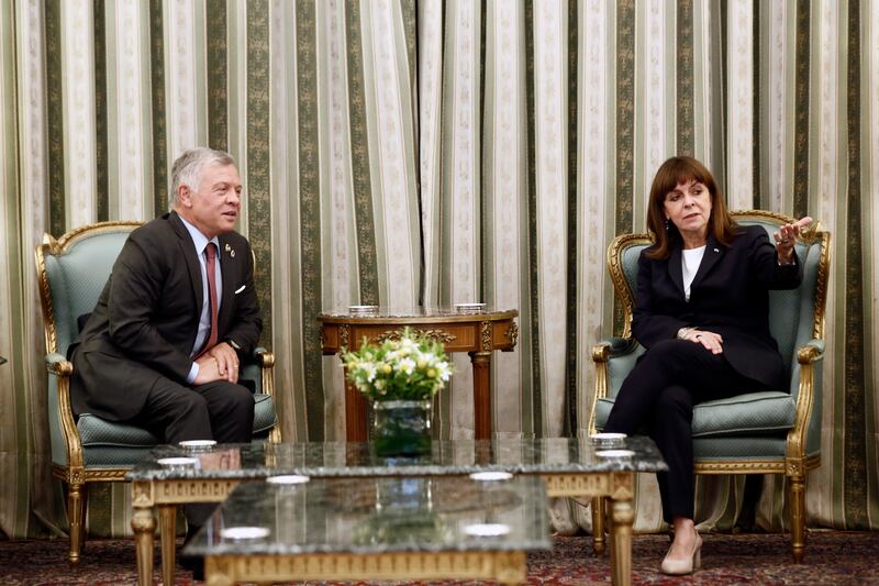 King Abdullah II of Jordan talks to Greek President Katerina Sakellaropoulou during their meeting in Athens, Greece.