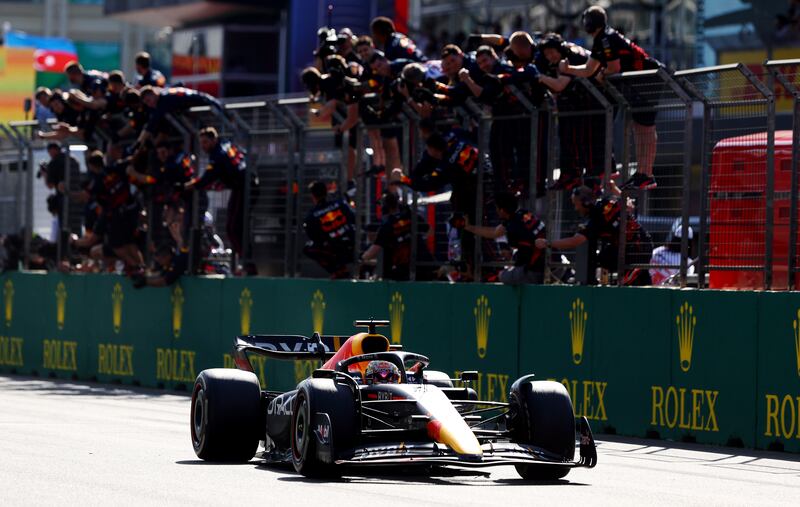 Race winner Max Verstappen greeted by his team. Getty