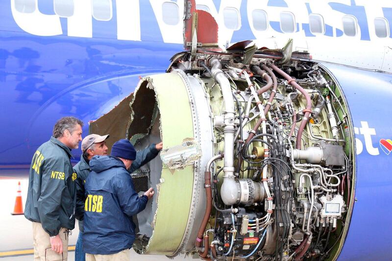 RESIZED. U.S. NTSB investigators are on scene examining damage to the engine of the Southwest Airlines plane in this image released from Philadelphia, Pennsylvania, U.S., April 17, 2018.    NTSB/Handout via REUTERS  ATTENTION EDITORS - THIS IMAGE HAS BEEN SUPPLIED BY A THIRD PARTY.     TPX IMAGES OF THE DAY