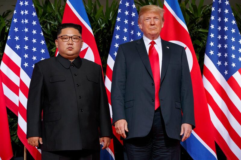 FILE - In this June. 12, 2018, file photo, U.S. President Donald Trump, right, meets with North Korean leader Kim Jong Un on Sentosa Island, in Singapore. South Korea has stopped calling North Korea an "enemy" in its biennial defense document published Tuesday, Jan. 15, 2019 in an apparent effort to continue reconciliation with Pyongyang. The development comes as U.S. and North Korean leaders are looking to set up their second summit to defuse an international standoff over the North's nuclear program. (AP Photo/Evan Vucci, File)