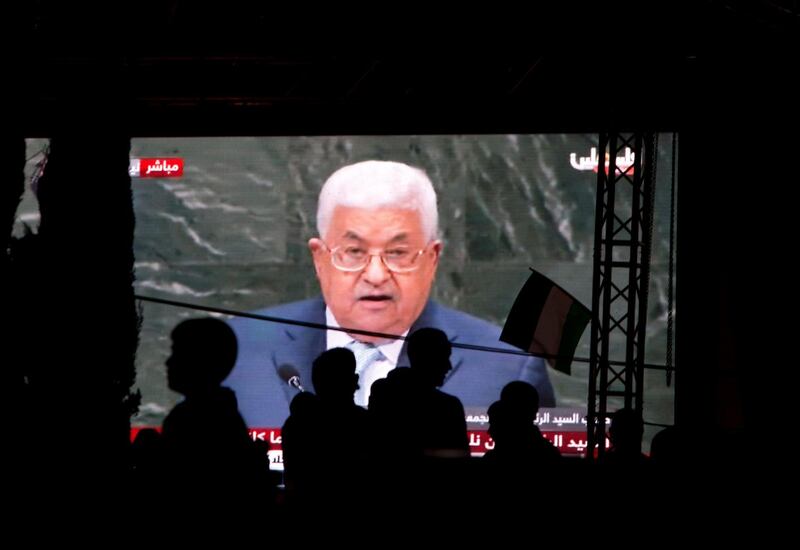 Palestinians watch a broadcast showing a speech by Palestinian President Mahmoud Abbas at the U.N. General Assembly shown on TV in the West Bank city of Nablus, Thursday, Sept. 27, 2018.(AP Photo/Majdi Mohammed)