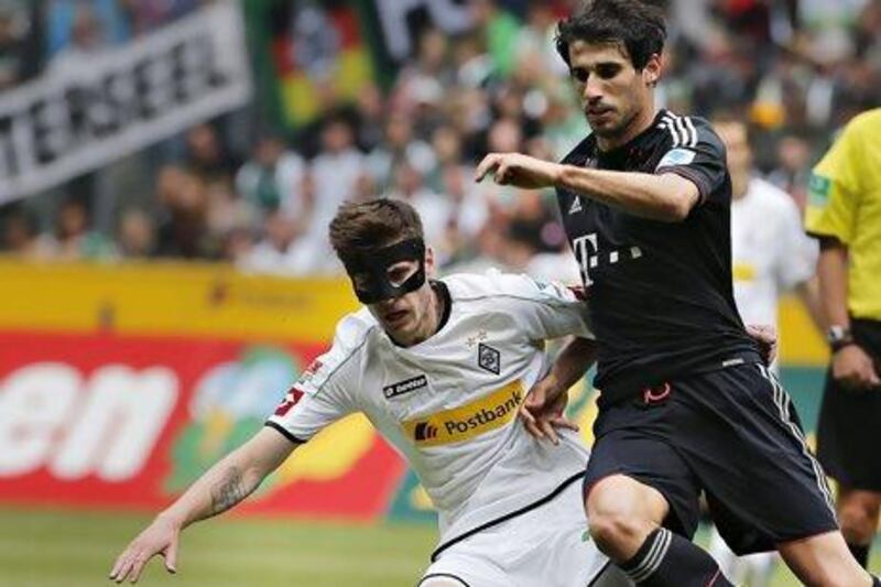 Javi Martinez, right, is part of a Bayern defence that allowed 18 goals in 34 league matches. Frank Augstein / AP Photo