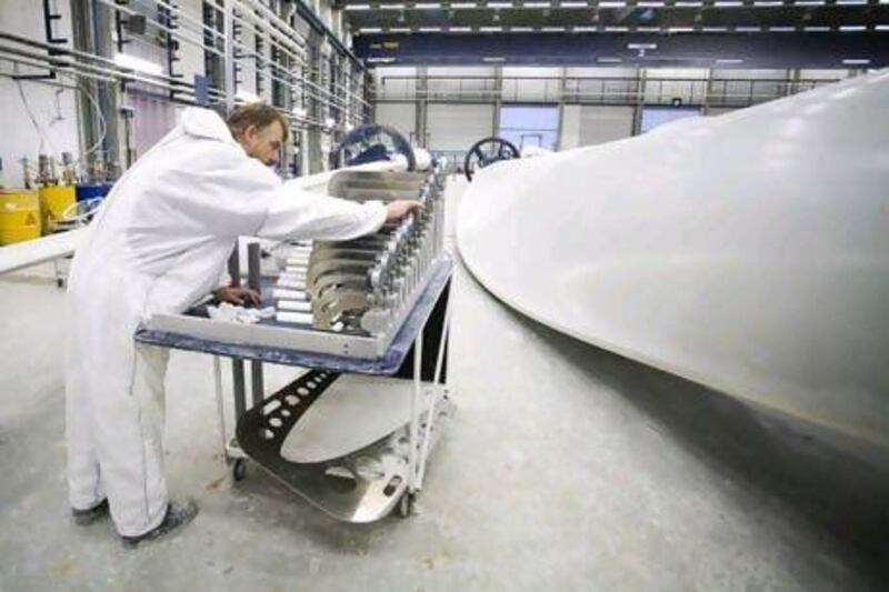 An employee selects a component for a wind turbine blade at the Vestas blade factory in Lem, Denmark.