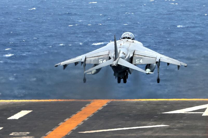 A US AV-8B Harrier aircraft takes off on the flight deck.