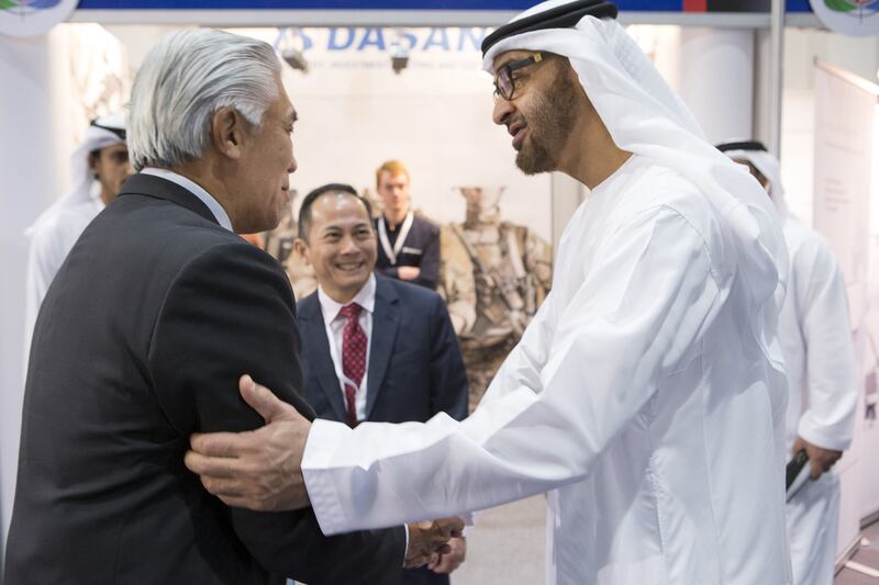 Sheikh Mohamed greets Patrick Choy, chief marketing officer, ST Kinetics. Sheikh Mohamed exchanged views with a number of representatives on exhibits, projects, and programmes at the event, WAM reported. Donald Weber / Crown Prince Court — Abu Dhabi