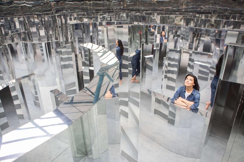 The artist with her work temporary 'Mirror Maze' installation