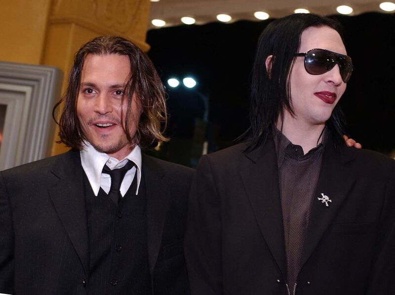 Depp with his friend, rock singer Marilyn Manson in 2001 in Los Angeles, California. AFP