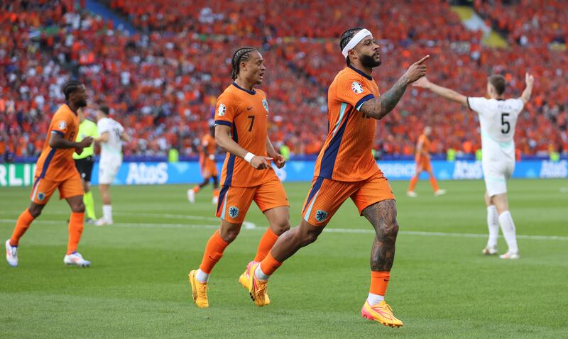 Memphis Depay celebrates after scoring his team's second goal against Austria with Xavi Simons. Getty Images