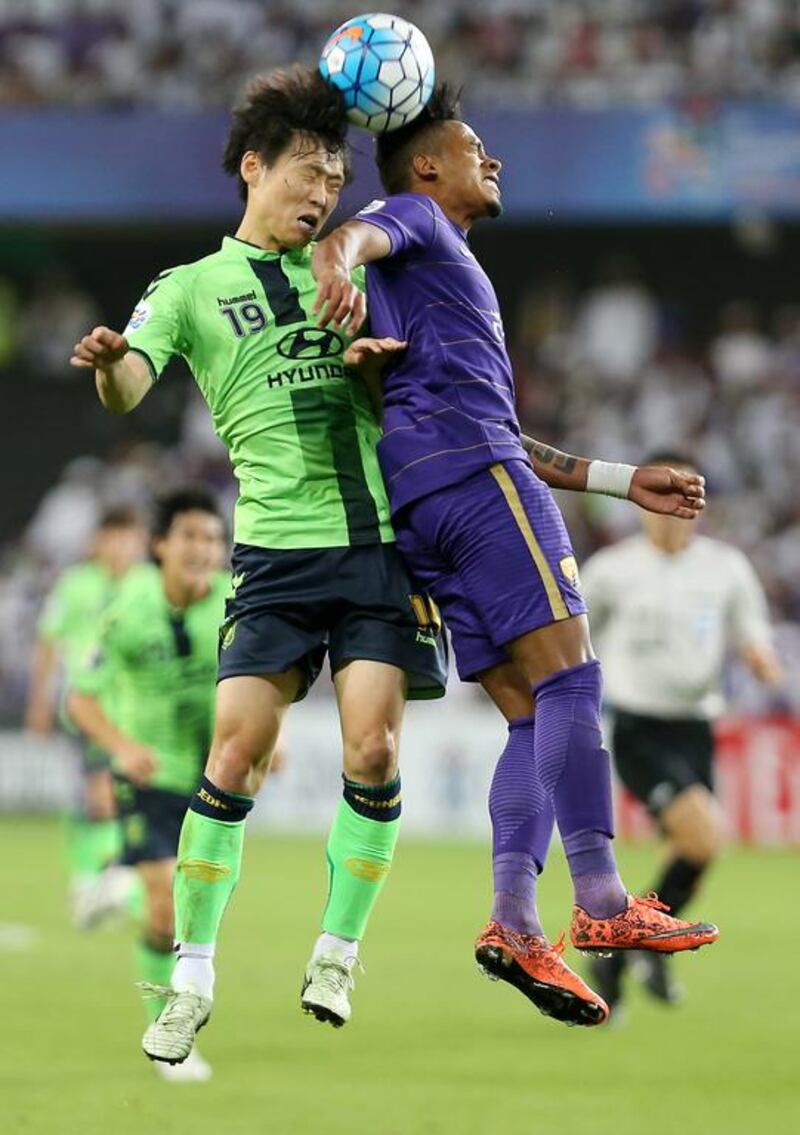 Al Ain forward Caio, right, and Park Wonjae of Jeonbuk Hyundai Motors in action during the Asian Champions League final second leg. Pawan Singh / The National