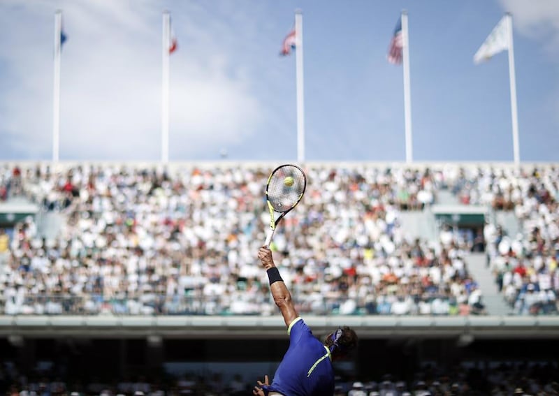 Rafael Nadal attempts a smash. EPA