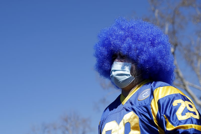 You're my boy, Blue! A Los Angeles Rams fan watches the big screen at the start of the NFL Super Bowl Champion parade in Los Angeles. EPA
