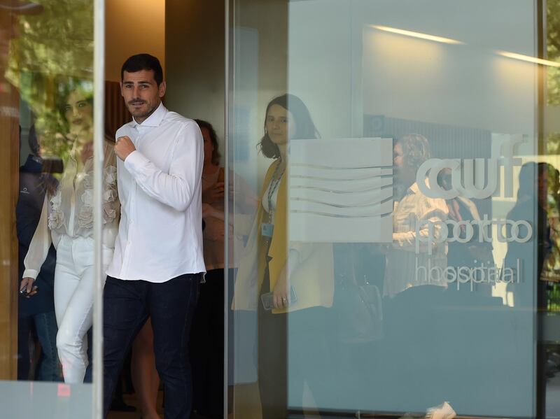 Porto's Spanish goalkeeper Iker Casillas leaves a hospital with his wife Sara Carbonero in Porto on Monday after recovering from a heart attack. Miguel Riopa / AFP