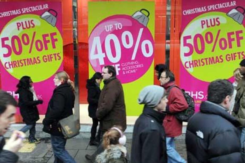 Christmas shoppers look for last minute bargains in London, Britain.