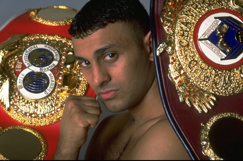 A portrait of Prince Naseem Hamed taken in 1997 with the IBF and WBO featherweight belts. John Gichigi/Allsport
