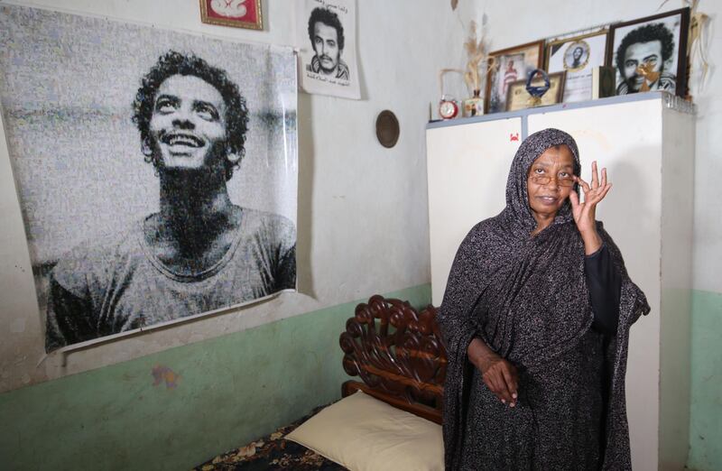 Sudanese Amna Abdulsalam, the mother of late youth protester Abdulsalam, stands in front of a memorial for her son on the eve of a raid where at least 128 people were killed and hundreds wounded outside Khartoum's army headquarters. AFP