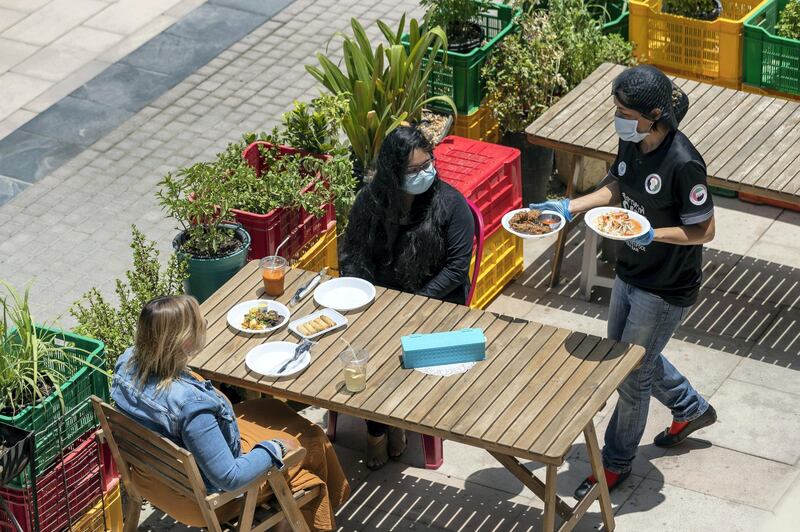Dubai, United Arab Emirates - Reporter: N/A. Coronavirus/Covid-19. People have lunch at Cafe Isan in JLT on a sunny day in Dubai. Monday, June 8th, 2020. Dubai. Chris Whiteoak / The National
