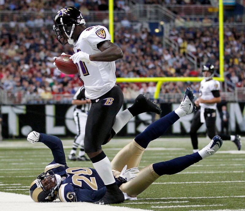 Baltimore Ravens wide receiver Anquan Boldin, top, steps out of bounds after catching a pass for a 15-yard gain as St. Louis Rams safety Darian Stewart, bottom, defends during the first quarter of an NFL football game, Sunday, Sept. 25, 2011, in St. Louis. (AP Photo/Jeff Roberson) *** Local Caption ***  Ravens Rams Football.JPEG-0e556.jpg