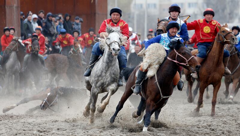 Riders take part in the traditional Central Asian sport of goat dragging, part of Nowruz celebrations, in Bishkek, Kyrgyzstan. EPA 