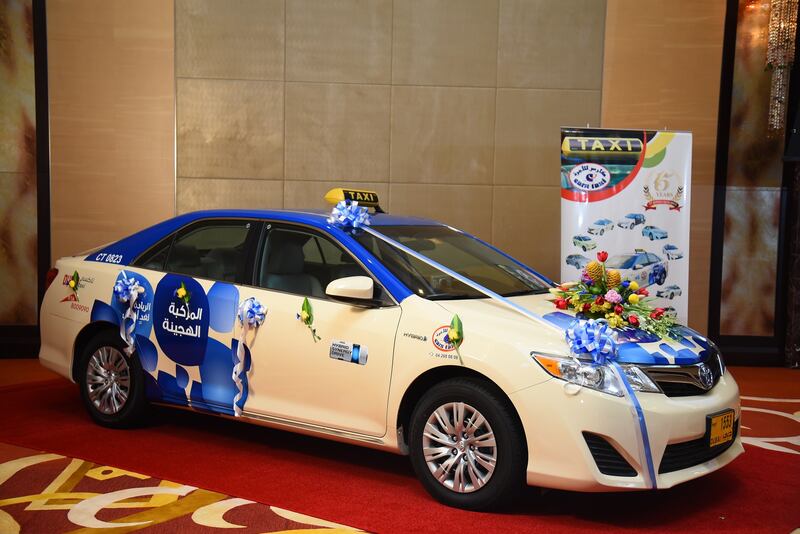 Handover of Toyota Camry hybrid vehicles to Cars Taxi by Al Futtaim Motors in Dubai.  Courtesy Al Futtaim Motors? *** Local Caption ***  Al-Futtaim Motors and Cars Taxi Camry Hybrid Handover (1).JPG