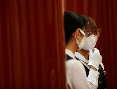 Staff members wearing protective face masks and shields attend a meeting at the Kabukiza Theatre, where Japan's stately traditional Kabuki theatre will resume on August 1 following a five-month closure due to the coronavirus disease (COVID-19) outbreak, in Tokyo, Japan July 31, 2020. Picture taken July 31, 2020. REUTERS/Issei Kato
