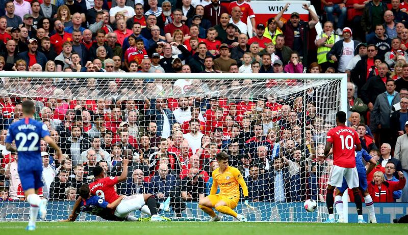 Martial slides in United's second goal. AP Photo