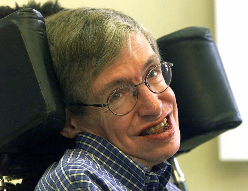 FILE - In this Wednesday, July 21, 1999 file photo Professor Stephen Hawking smiles during a news conference at the University of Potsdam, near Berlin, Germany. Hawking, whose brilliant mind ranged across time and space though his body was paralyzed by disease, has died, a family spokesman said early Wednesday, March 14, 2018.(AP Photo/Markus Schreiber, File)
