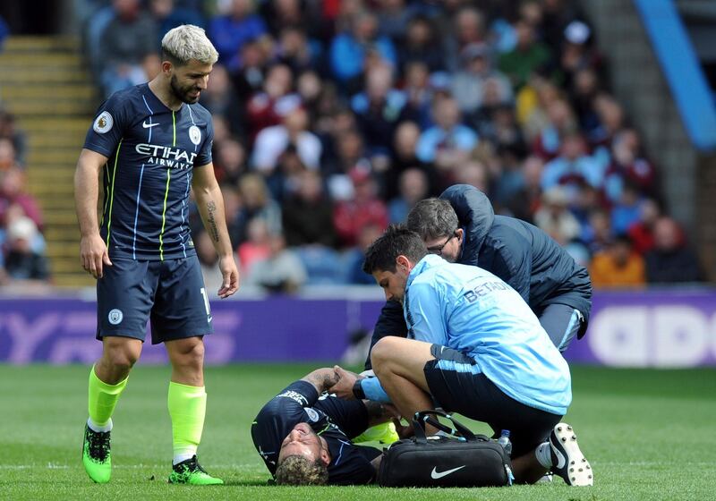 Kyle Walker receives medical treatment. AP Photo