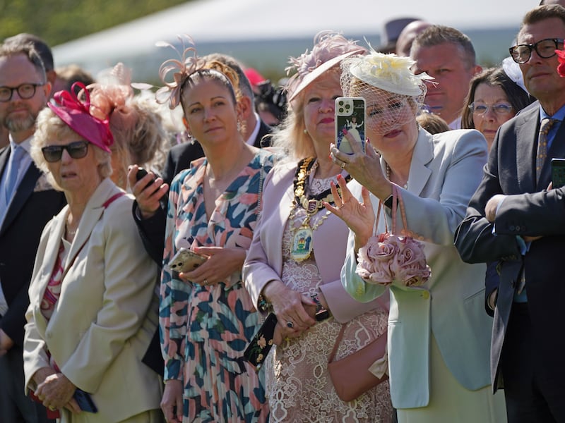 Guests at the garden party to celebrate the coronation of King Charles III and the Queen Consort. AP