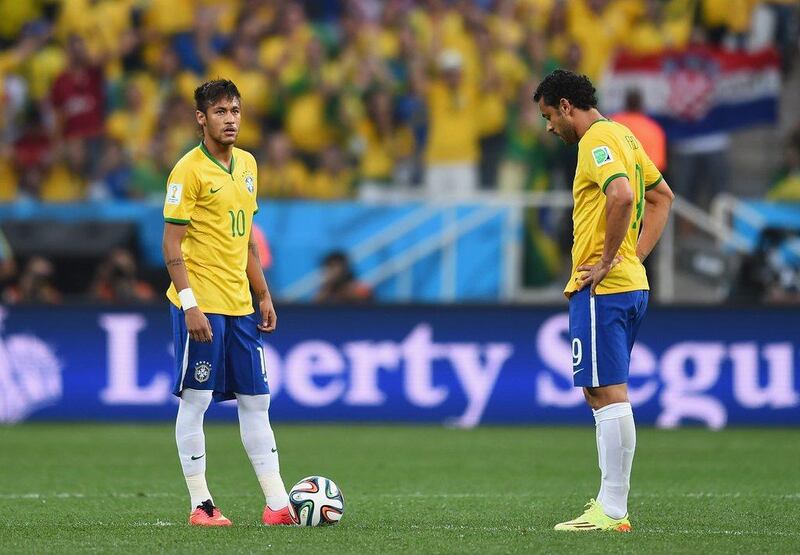 Neymar, left, and Fred, right, wait to kick off for the first match of the 2014 World Cup on Thursday between Brazil and Croatia at the Arena Corinthians in Sao Paulo, Brazil. Christopher Lee / Getty Images