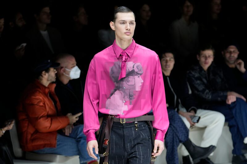 Silken shirts with foulards in bright accent hues such as magenta, purple and mauve at Emporio Armani. AP